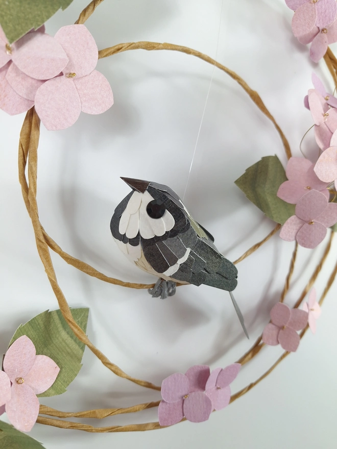 handmade paper sculpture of a coal tit bird