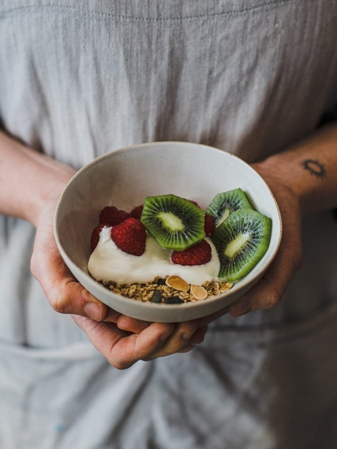 handmade ceramic breakfast bowl with fruit and cereal