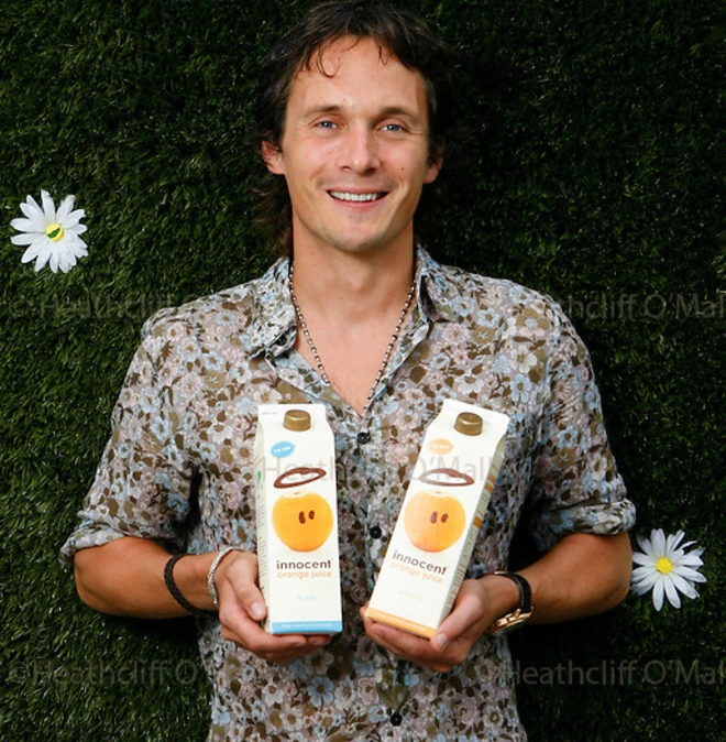 Richard Reed CBE, founder of Innocent, holding cartons of juice