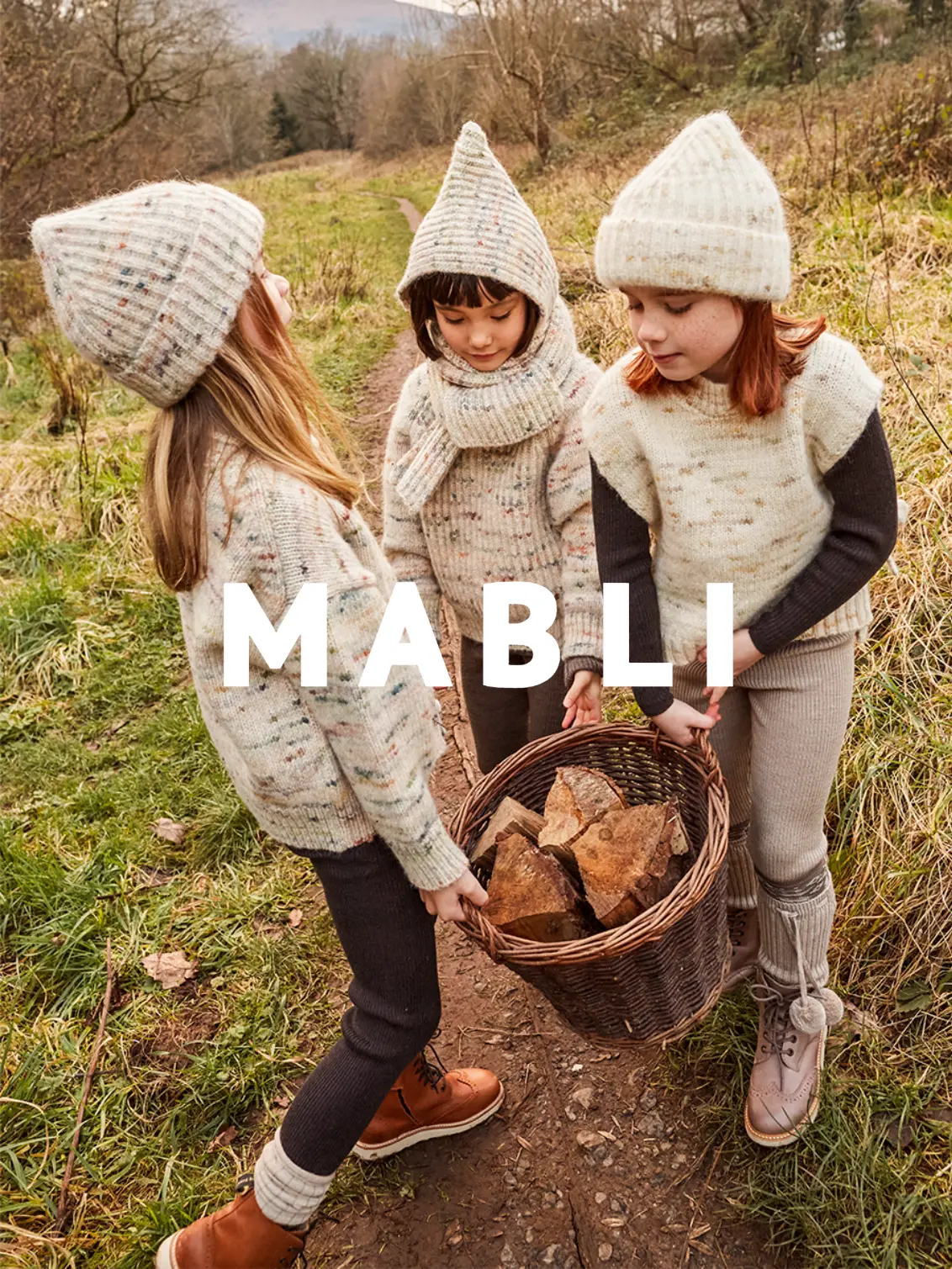 MABLI's 'Blewog' collection in 'Jewel Speckle' and 'Moss Speckle' features soft, relaxed-fit garments with speckled chunky yarn, perfect for Autumn/Winter.