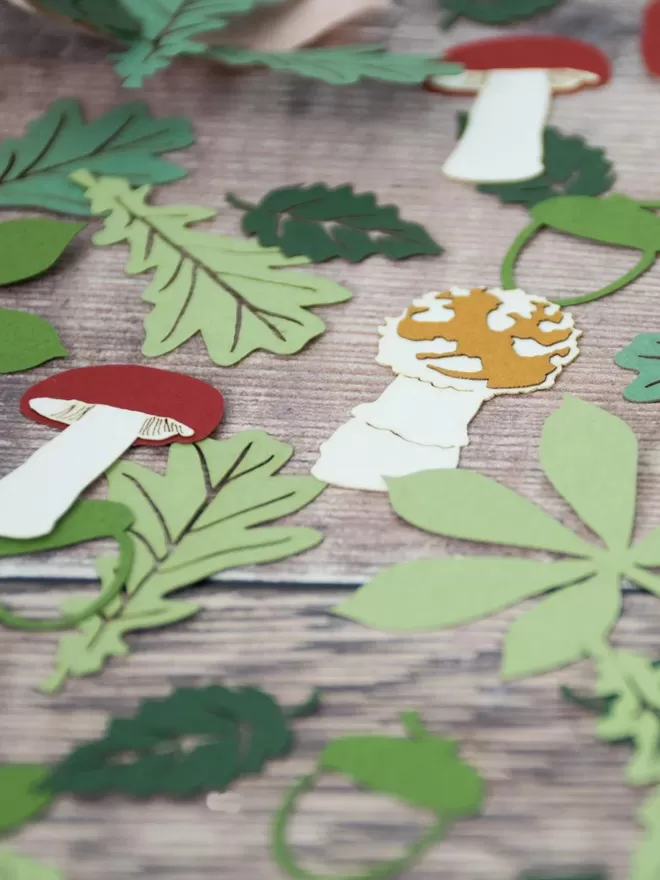 Woodland confetti including toadstools, oak leaves, acorns and birch leaf shapes