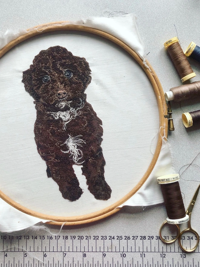 photo shows the making of an embroidered pet portrait