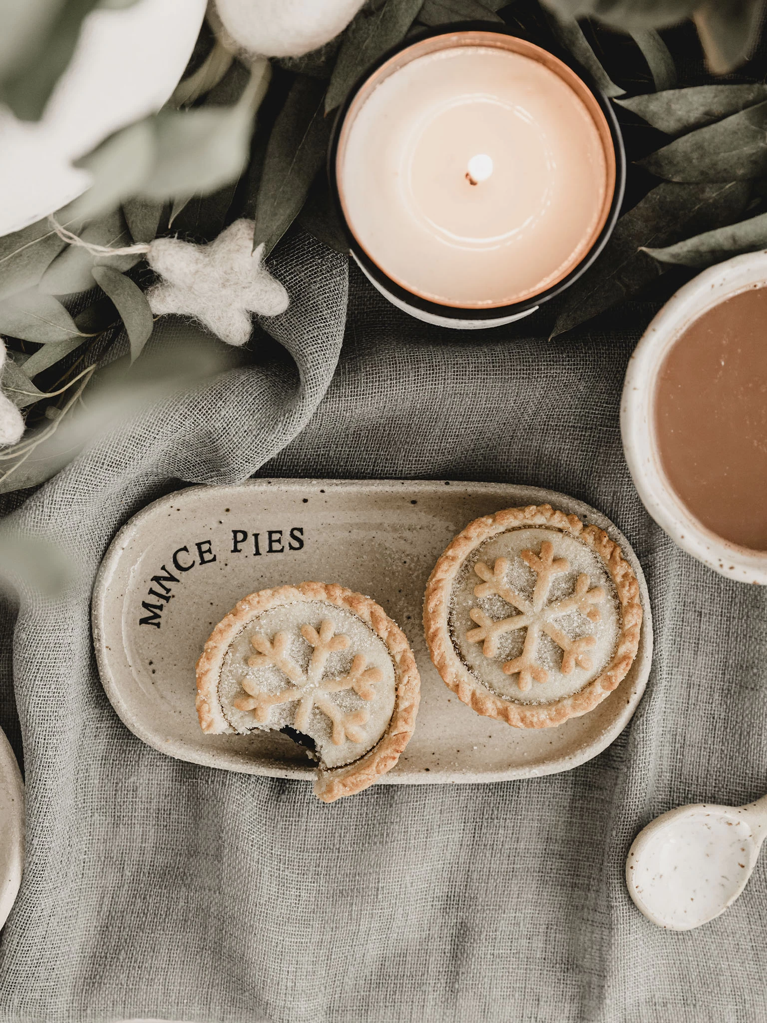 2 mince pies on an oval ceramic plate