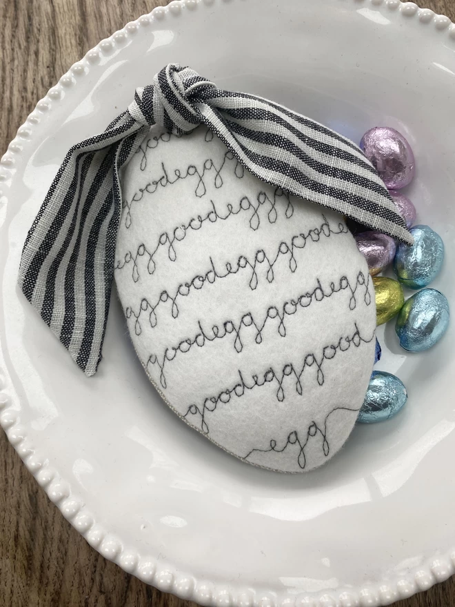 Embroidered Easter Egg Pouch with repeat good egg embroidered in bowl with chocolate eggs