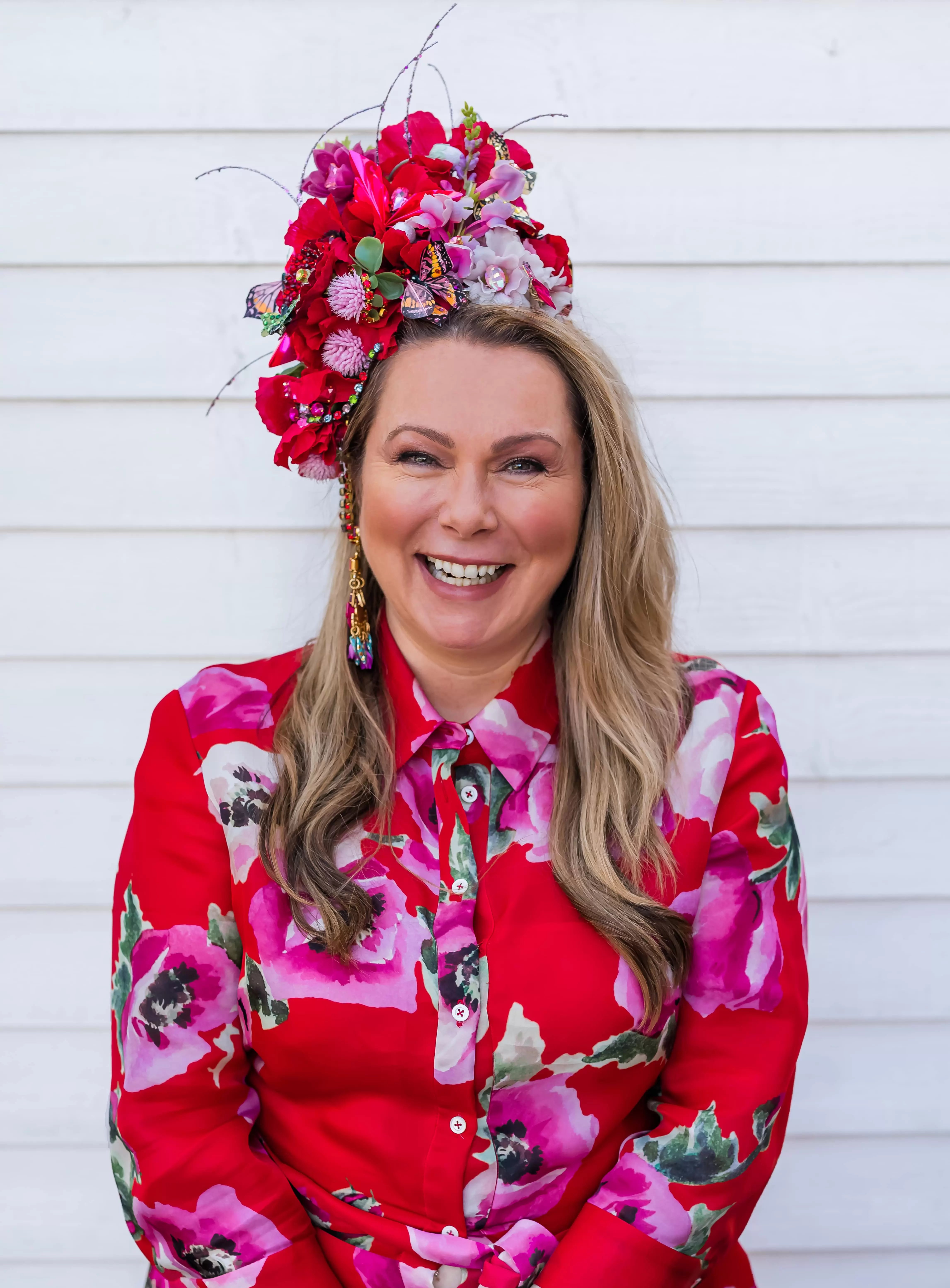 Holly Tucker, founder of Holly & Co, wearing a flower-head piece. 