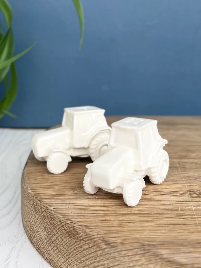 Handmade Tractor Salt and Pepper pots, finished in a ‘soft white’ clay and glossy glaze.