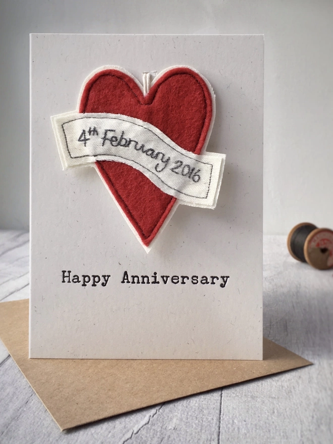 Anniversary card with personalised handmade hanging heart decoration