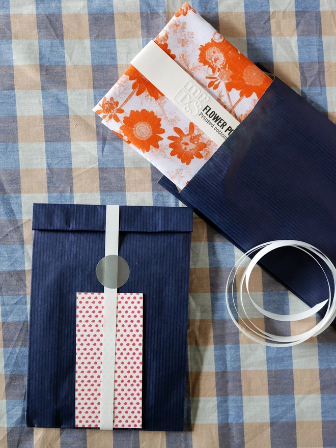 Optional gift wrap for Mr.PS Flower Power hankie of navy paper and ribbon with a dotty gift card