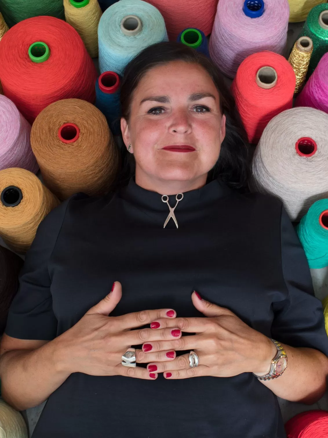 Image of Kate Jenkins in her studio lying on string by Mark Vessey.