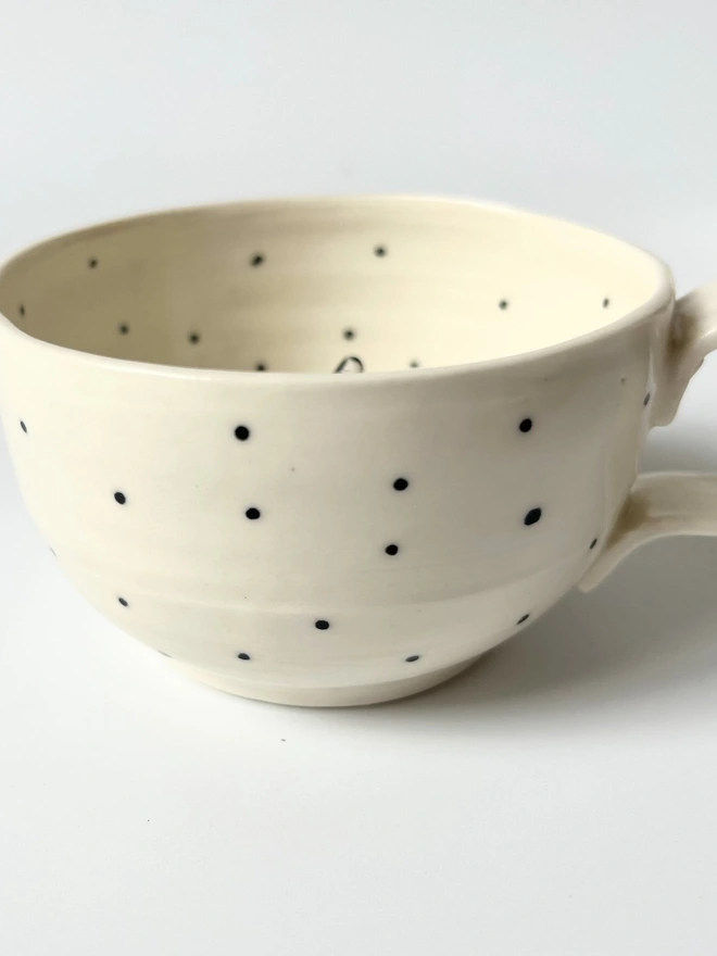  White Porcelain Cup With a Little Figure Sitting