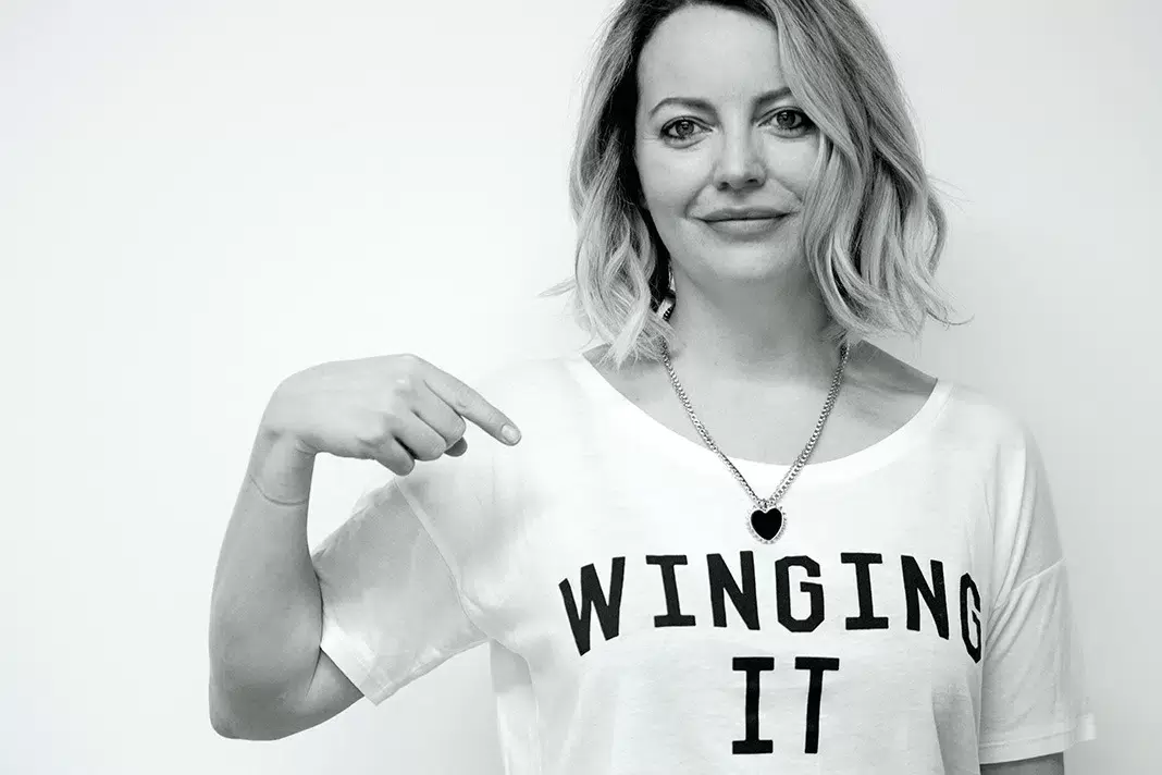 Molly Gunn, founder of Selfish Mother, wearing a 'Winging It' t-shirt