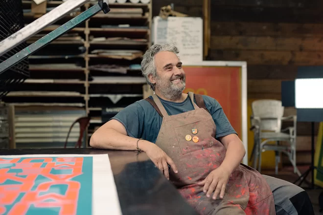 Dave Buonaguidi sat in his studio in an apron