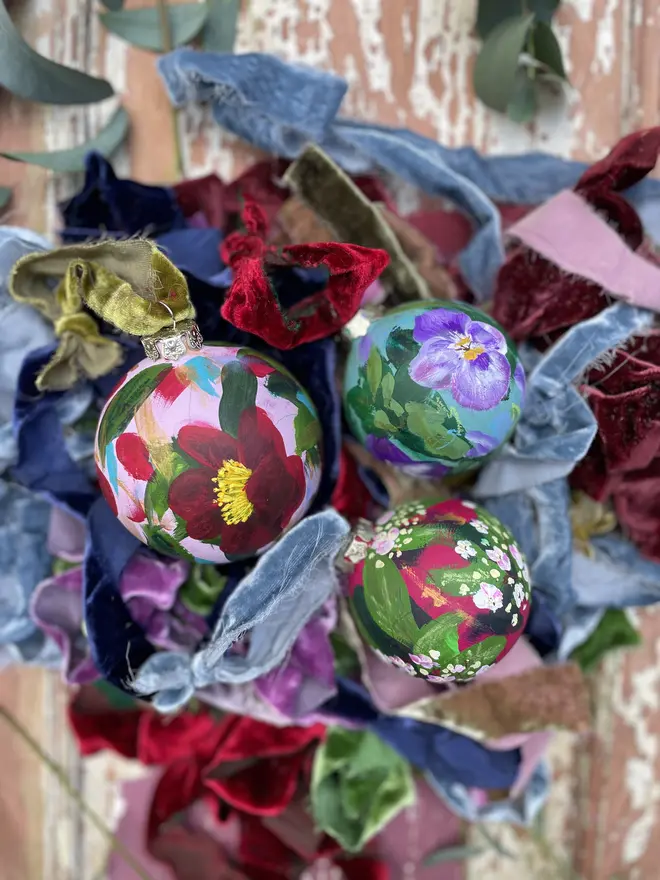 hand painted floral Christmas baubles 