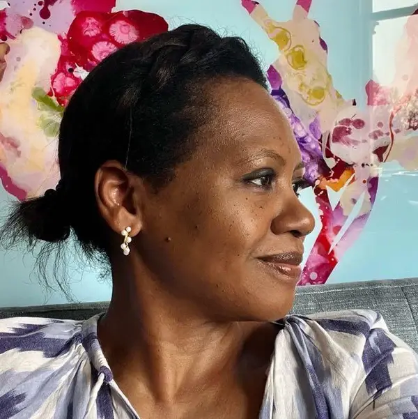 isatu's side profile, smiling while facing away from camera