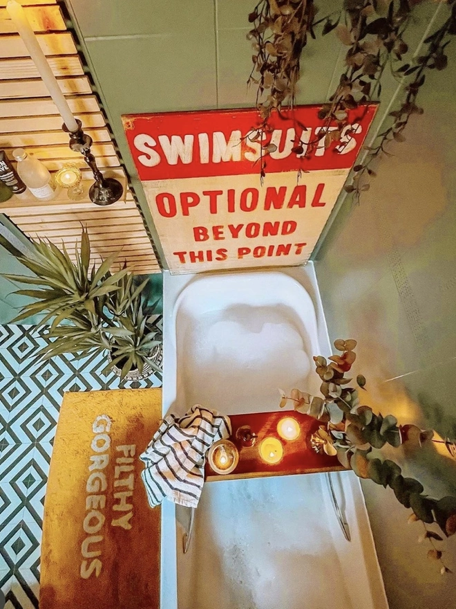 'Swimsuits Optional Beyond This Point' Sign