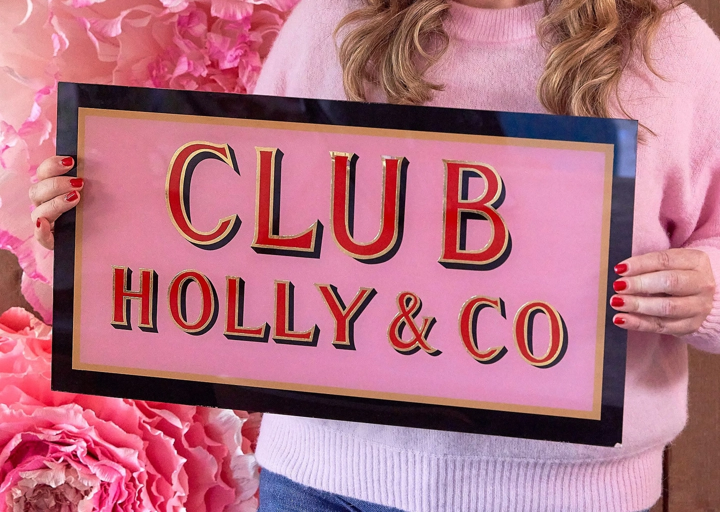 Club holly & co sign with pink flowers