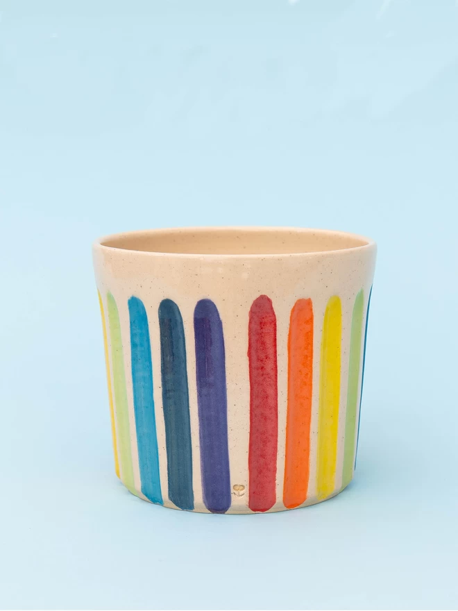 rainbow striped carved pottery planter back view