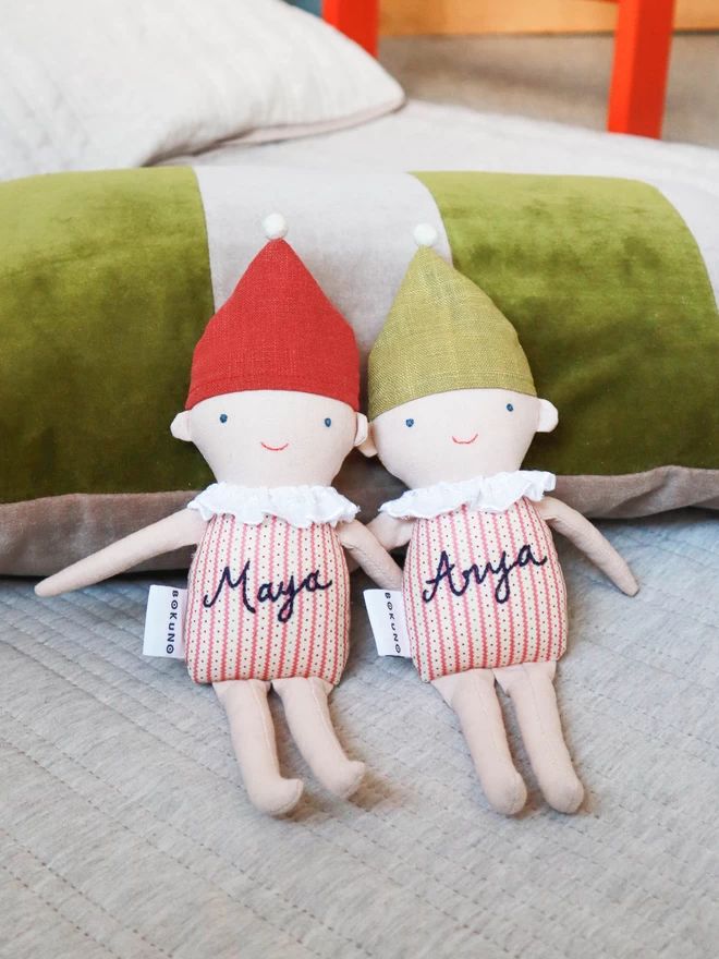 Stuffed linen elf dolls with green and red hat, name embroidered on the stripe body.