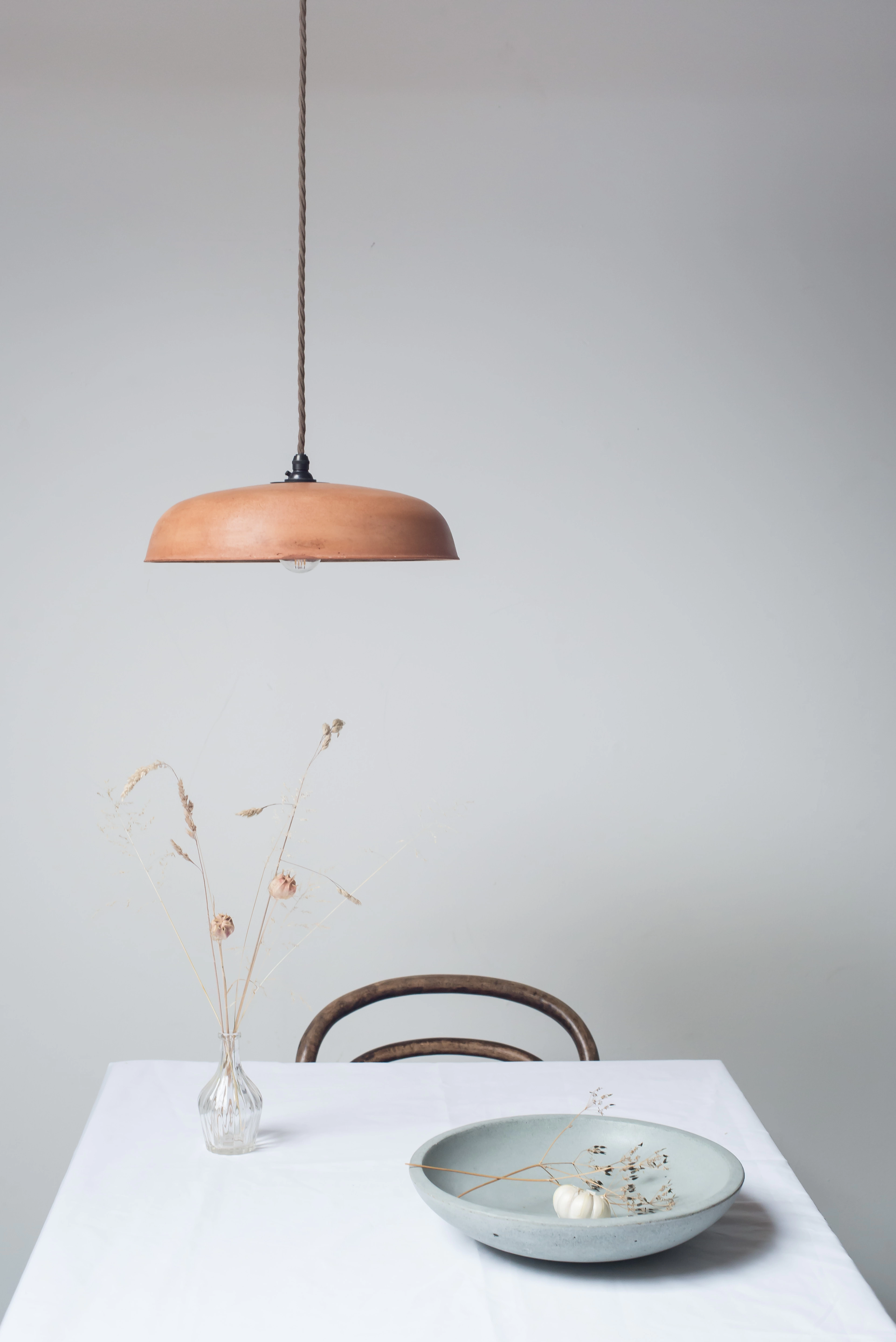 Original handmade orange pendant lampshade made from cement mortar plaster and copper pigment