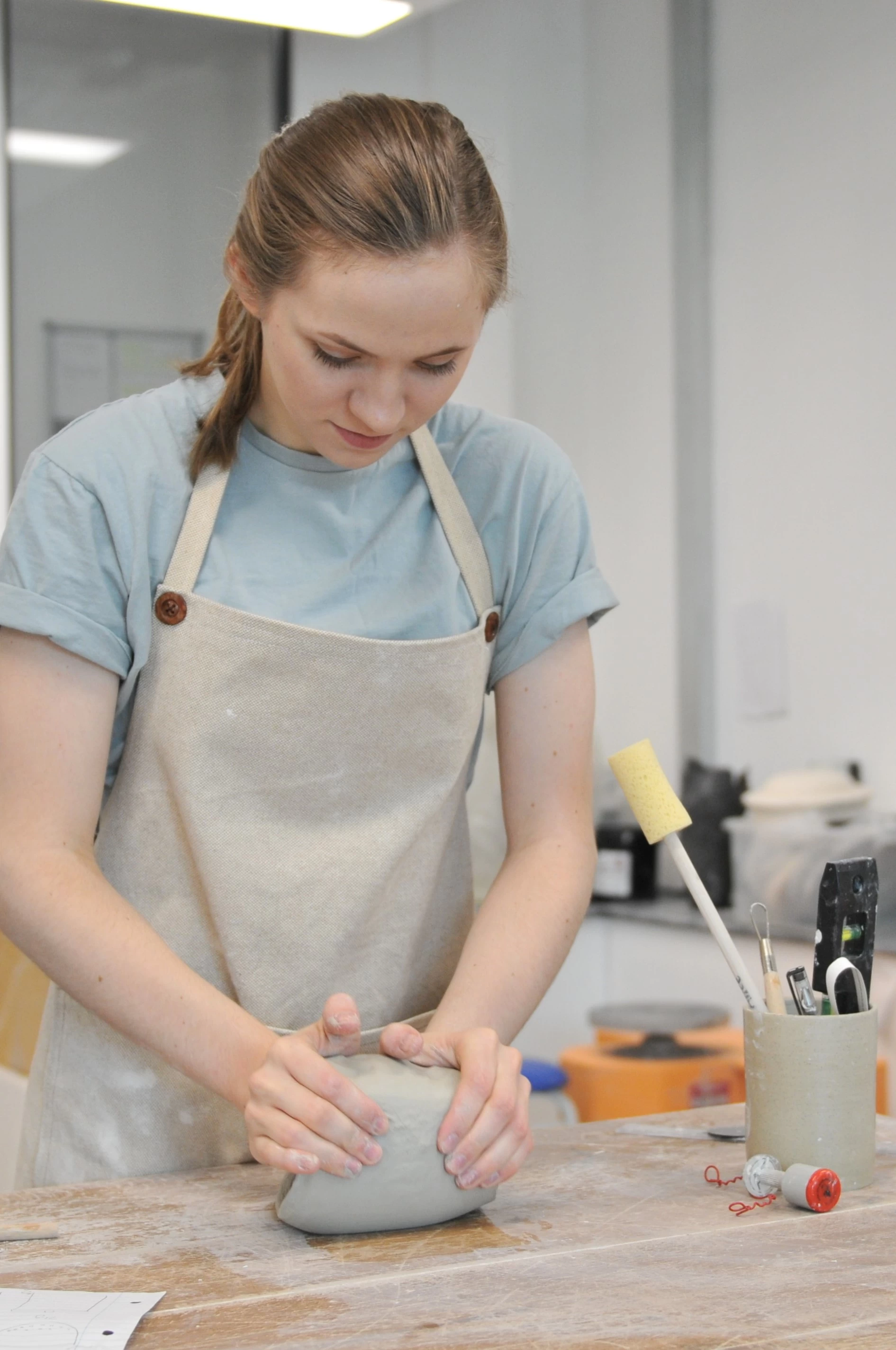 alice preparing the clay ready for making in the studio