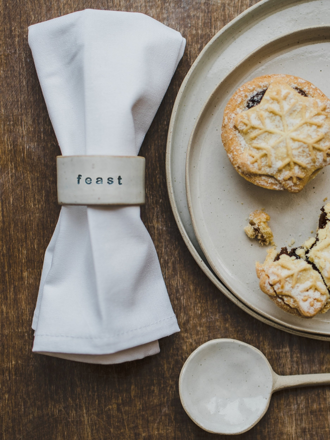 feast napkin ring on white napkin