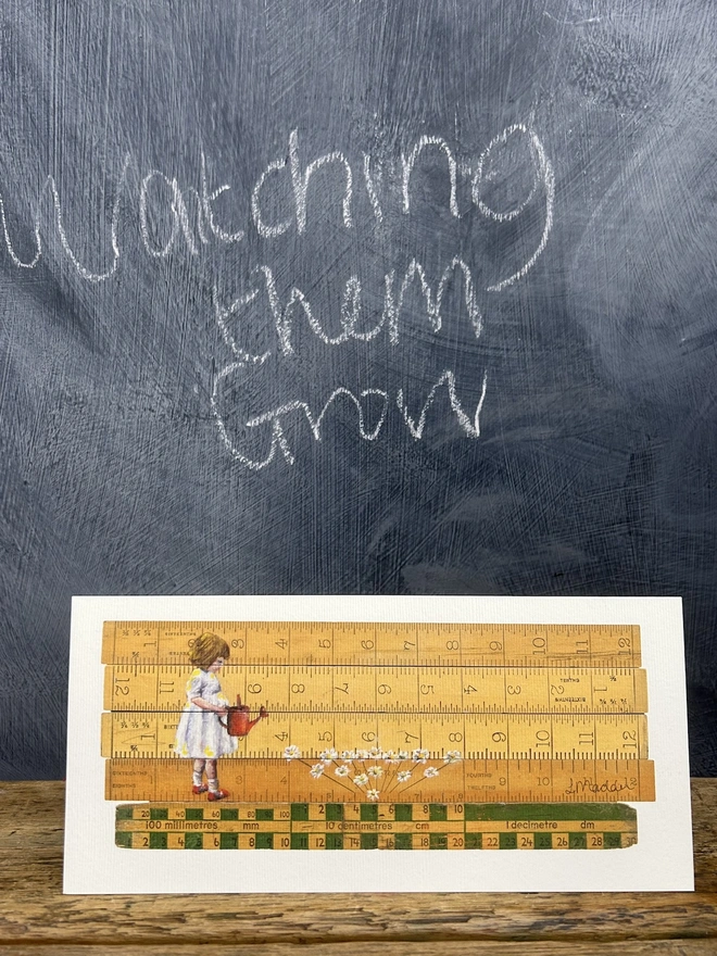 little girl wearing a white dress watering white flowers from a red watering can