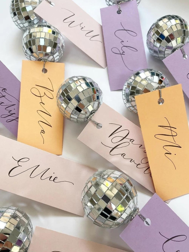 handwritten calligraphy disco ball wedding place card settings