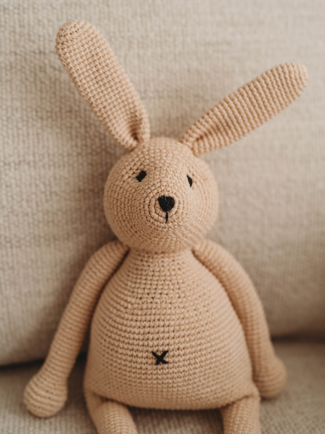 handmade crochet bunny rabbit on sofa