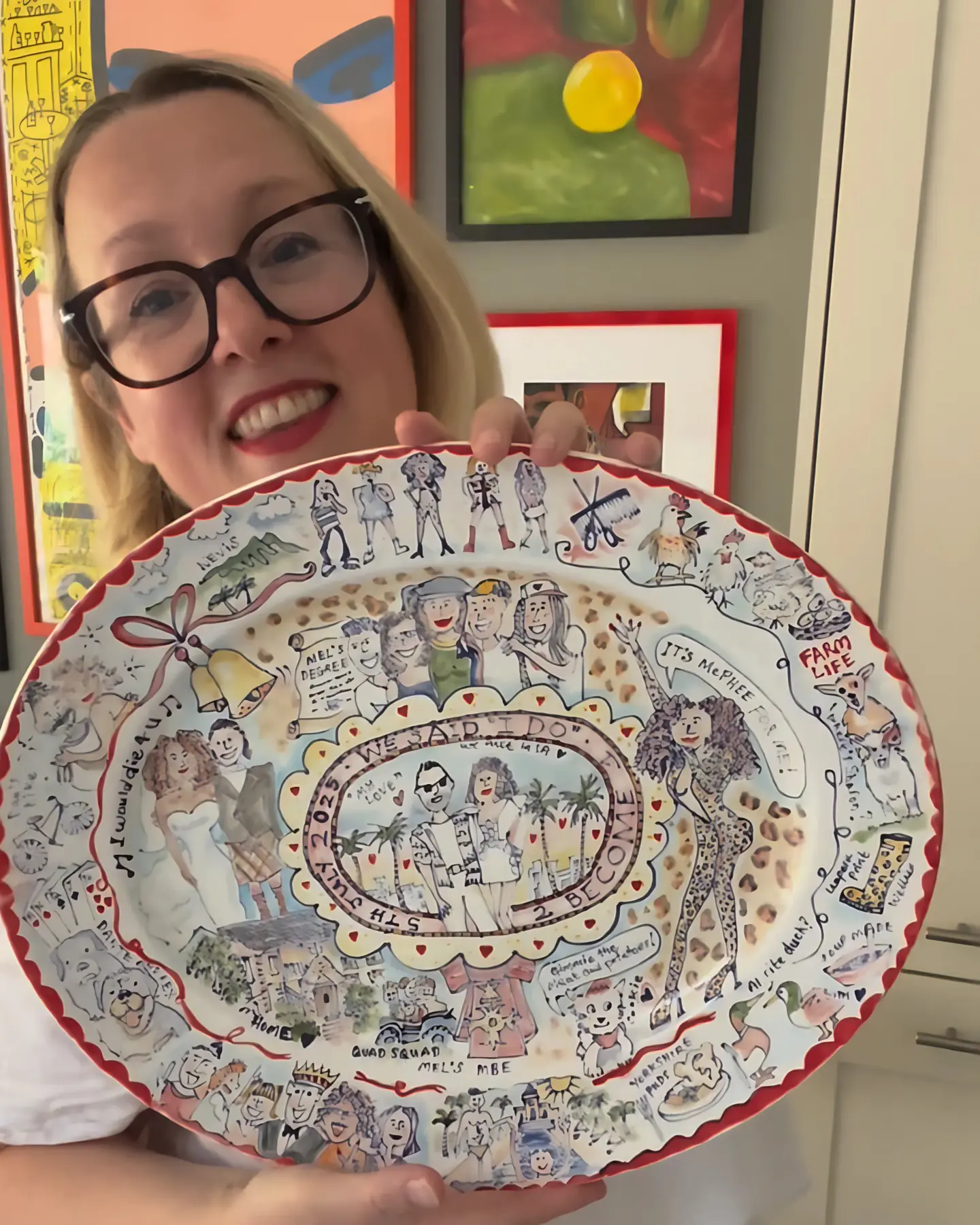 Karen Willis holds a very special commission she hand-painted for a Spice Girl to commemorate her Wedding Day