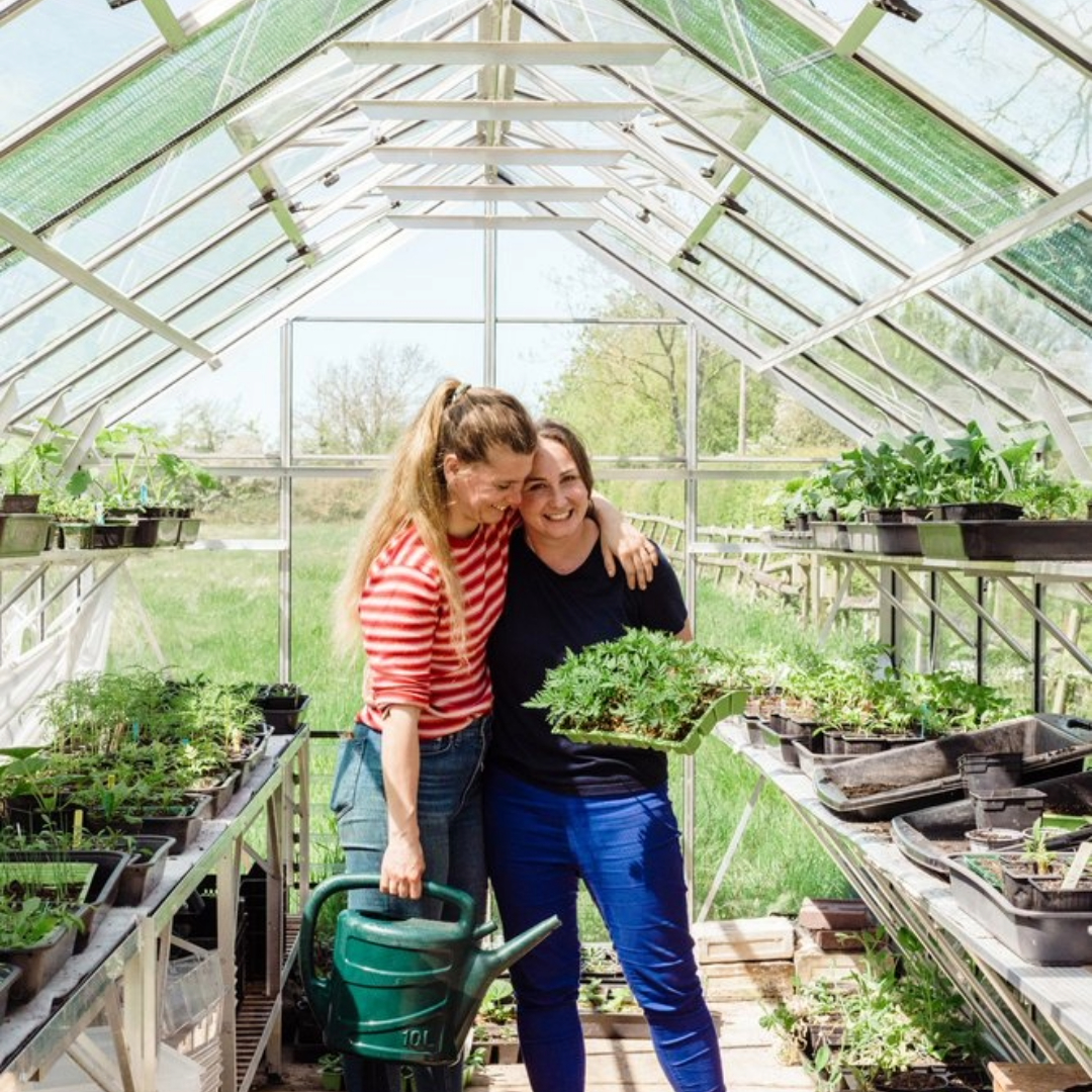 Founders in the greenhouse growing dye flowers for textiles