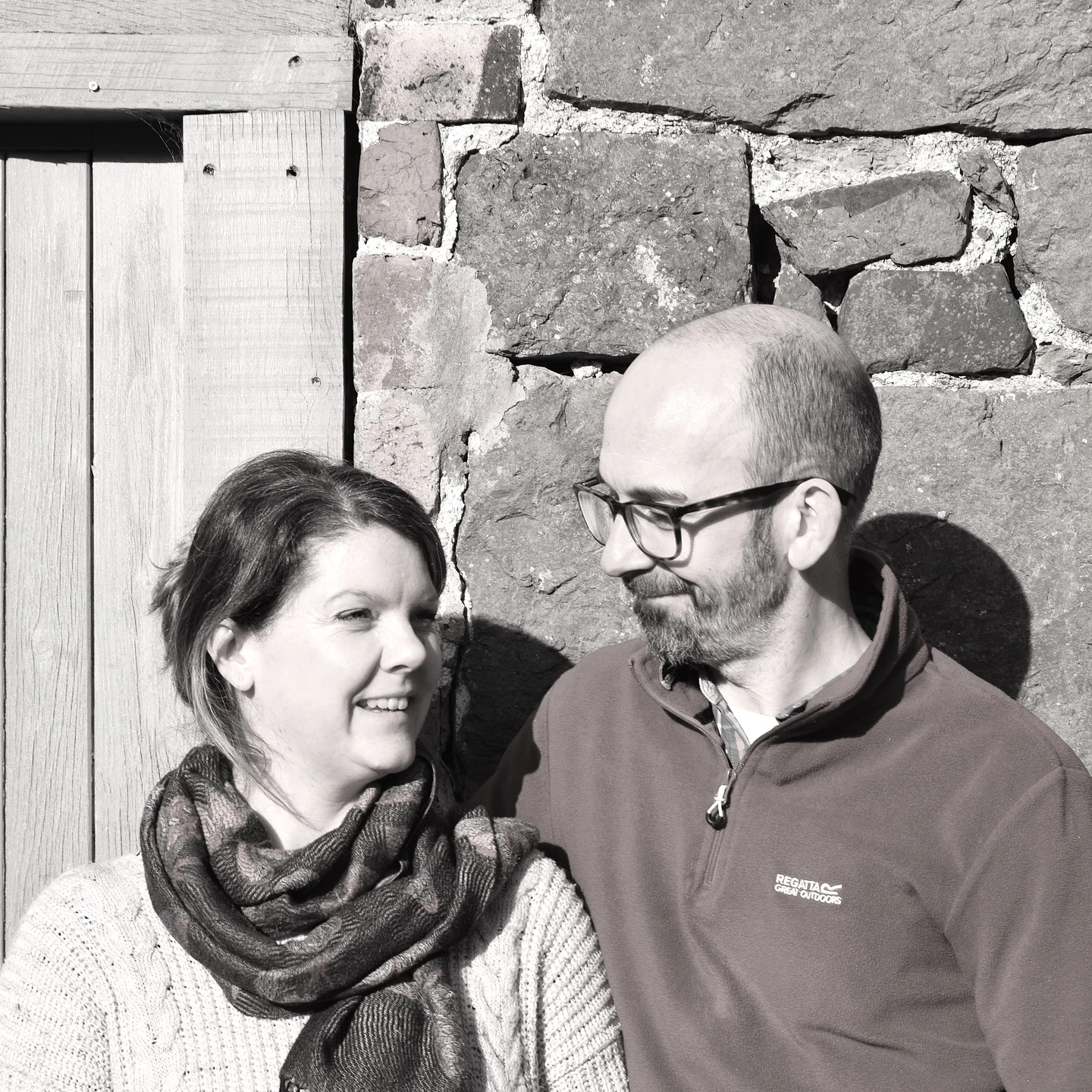 Rebecca and Martin from Eric and Alberts standing outside the stone barn toyshop in Mid Wales