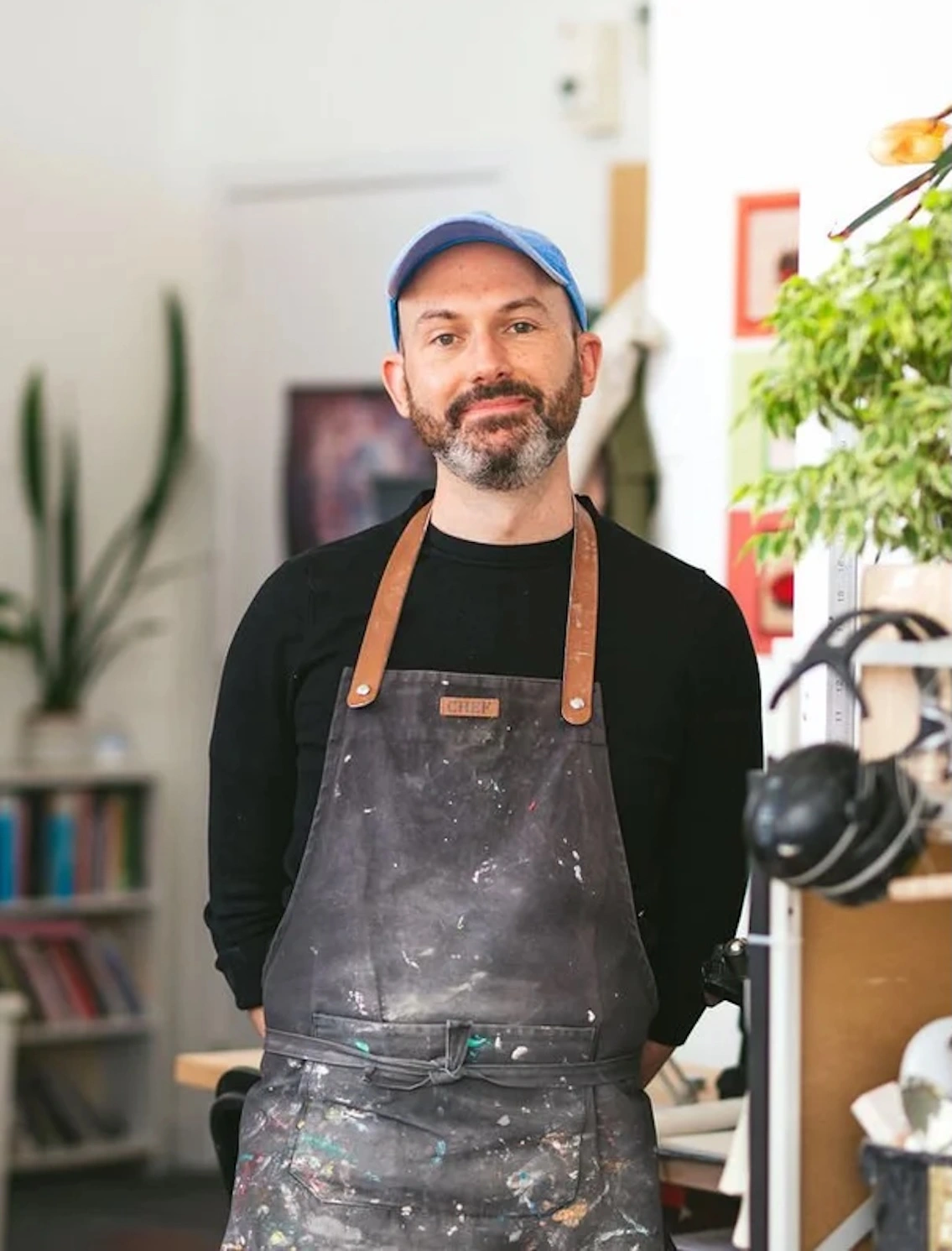 david wearing an apron and smiling in his studio