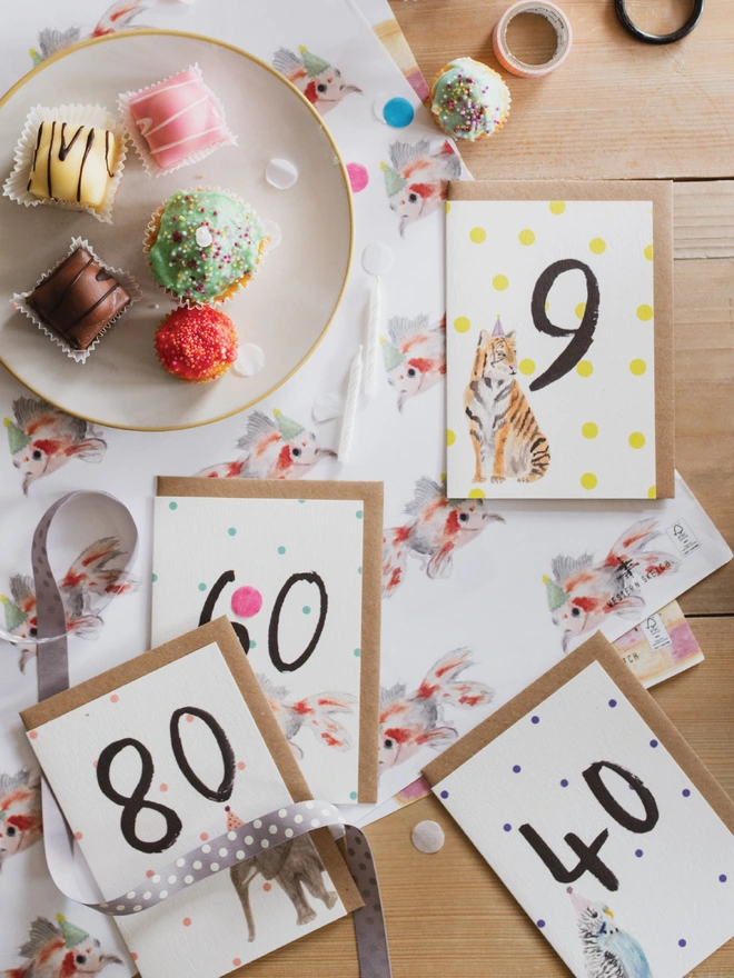 A selection of hand painted birthday milestone cards 