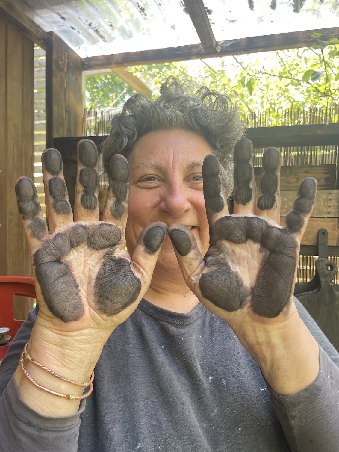 Founder Hayley with mucky hands from the Yakisugi charring process