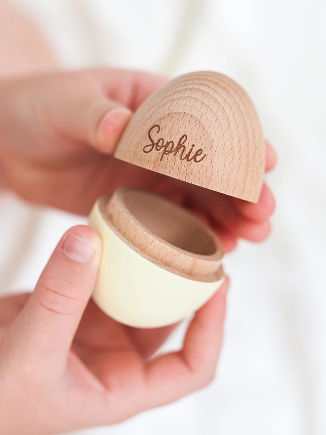 Hollow wooden egg in buttermilk with the name Sophie