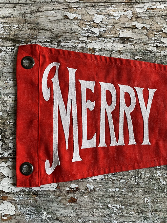 Detail Of A Red Merry Christmas Pennant Flag