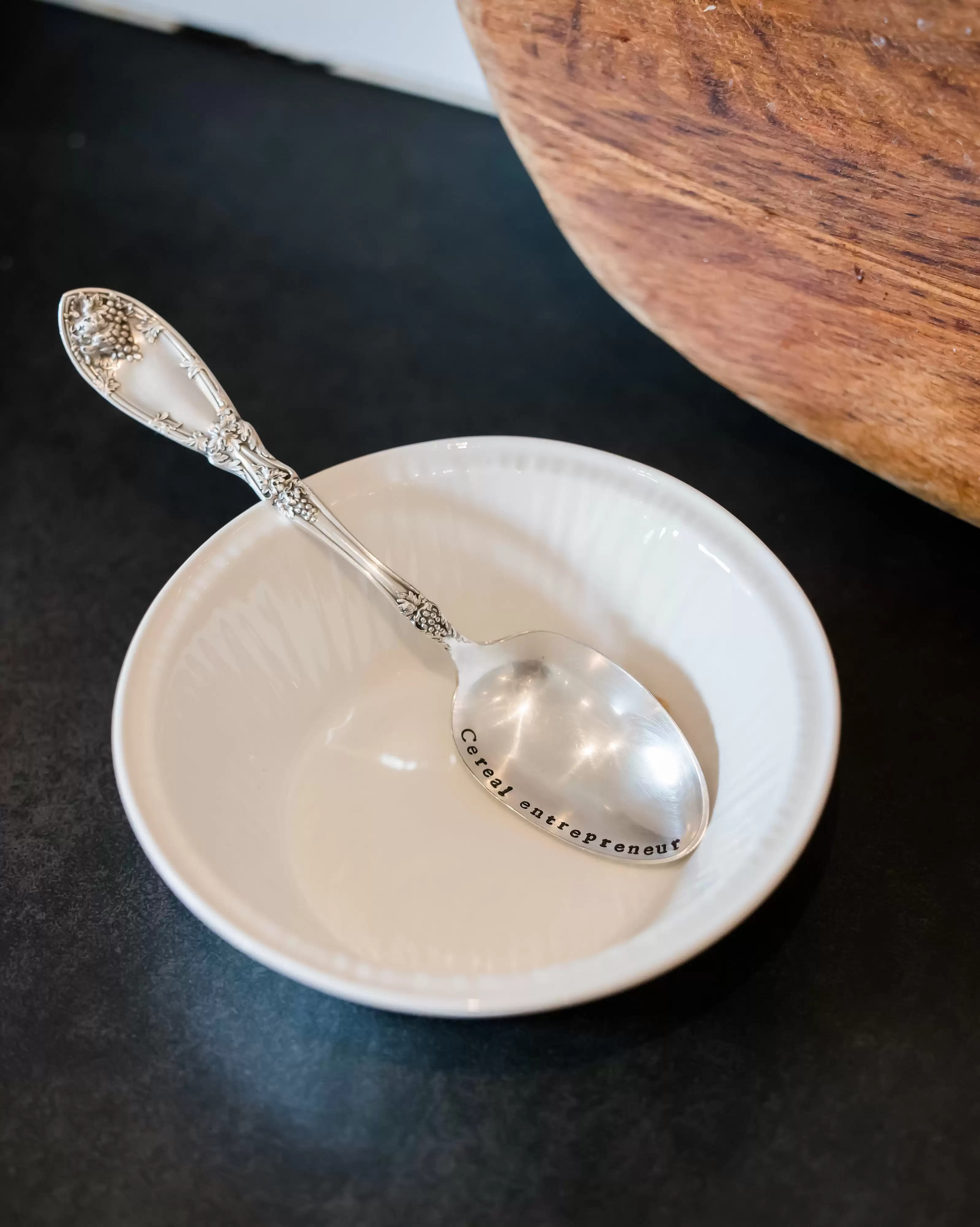 Cereal entrepreneur silver teaspoon in white bowl