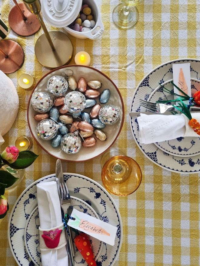 An overhead shot of a table with plates with the tulip napkin ring featured