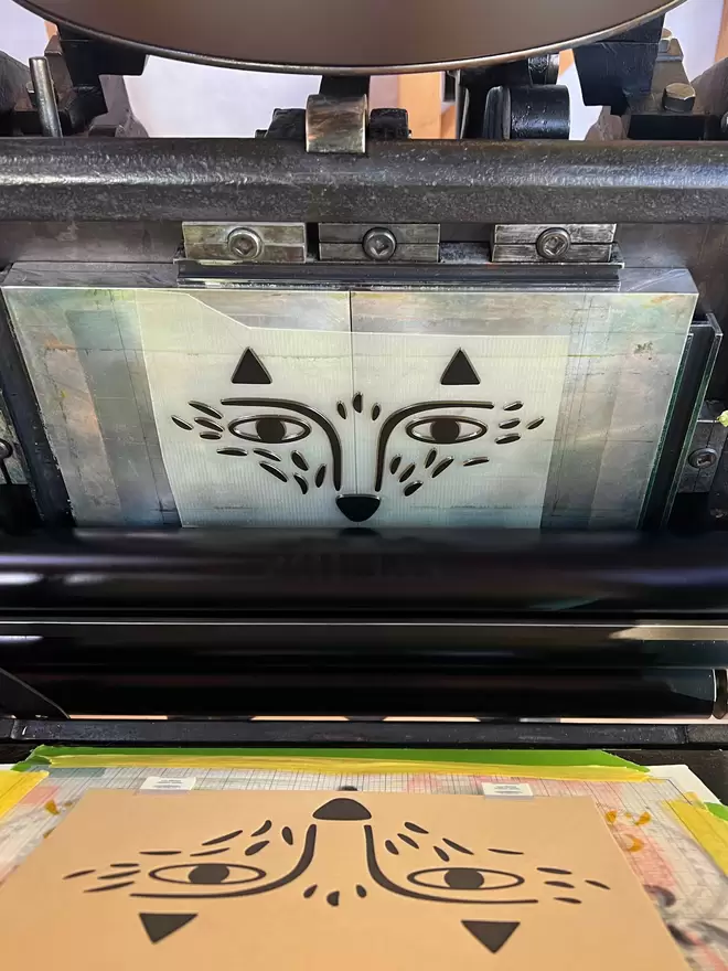 Fox plate with black ink set up on a vintage press.