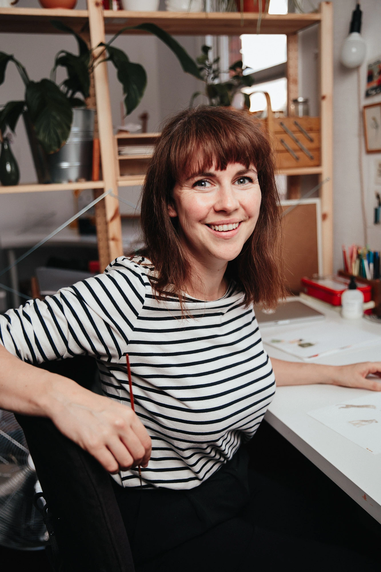 Helen illustrating in the studio