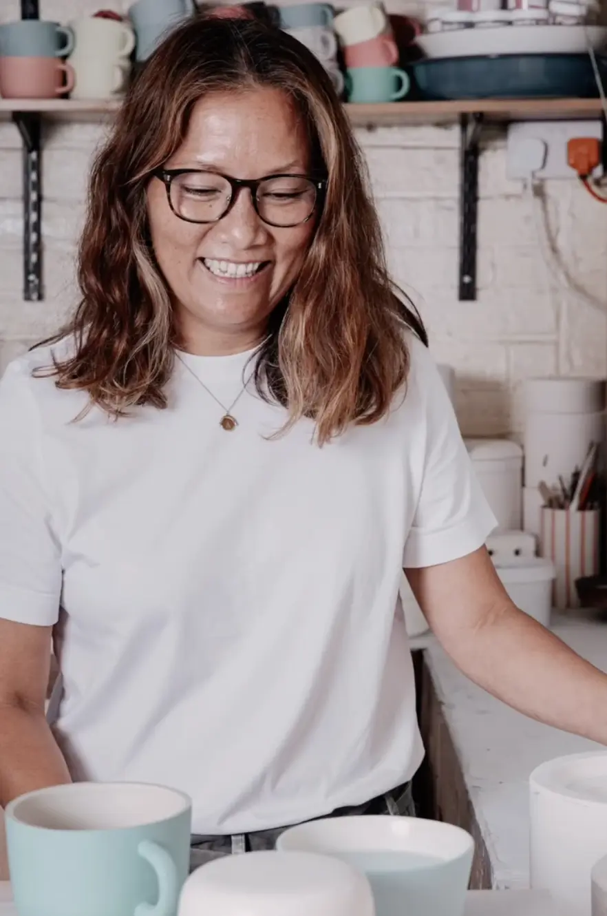 aey smiling in her studio