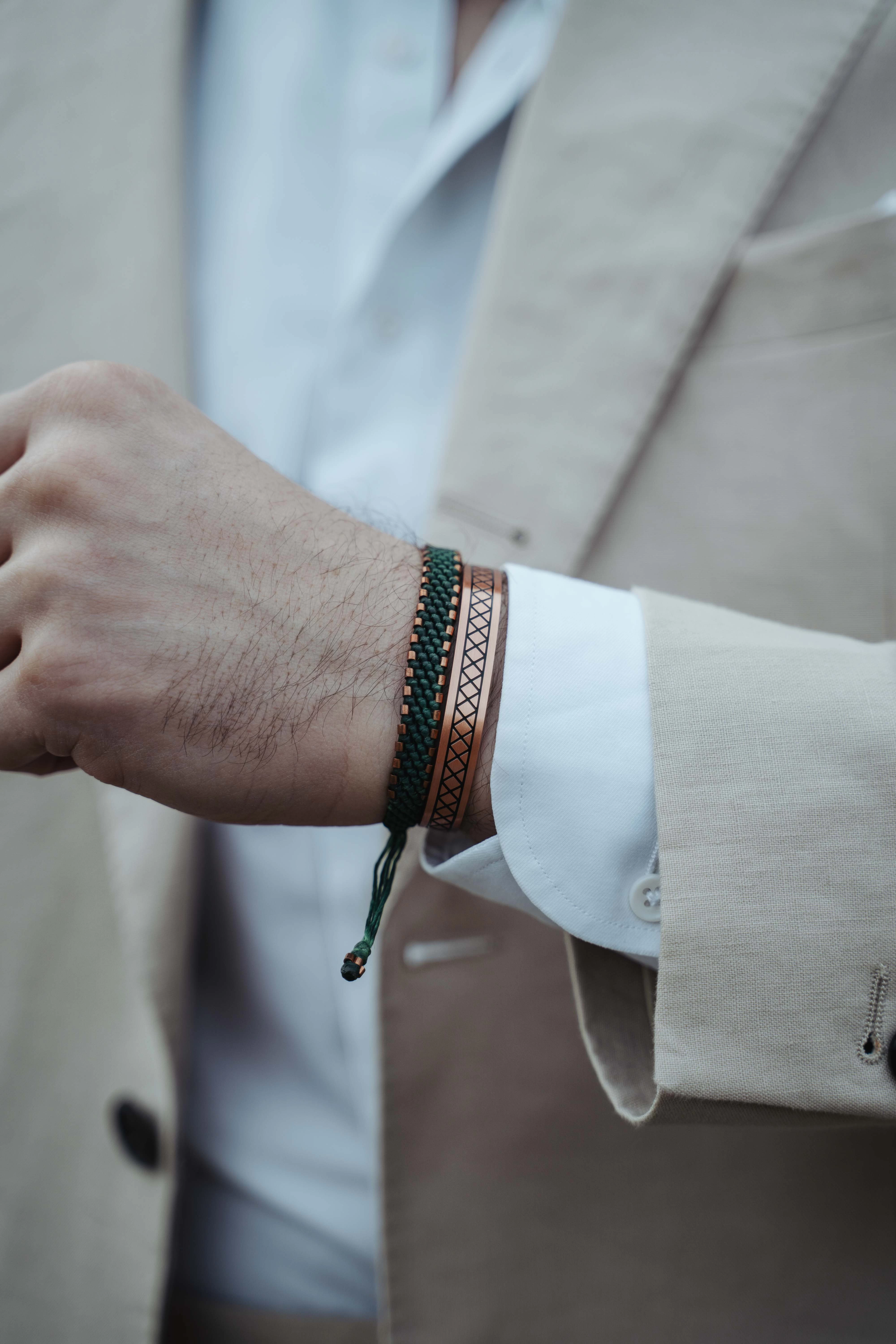 men wearing some of our exclusive copper bracelets