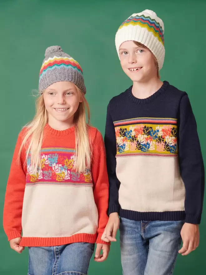 Boy and girl wearing both colours of the navigator hat.