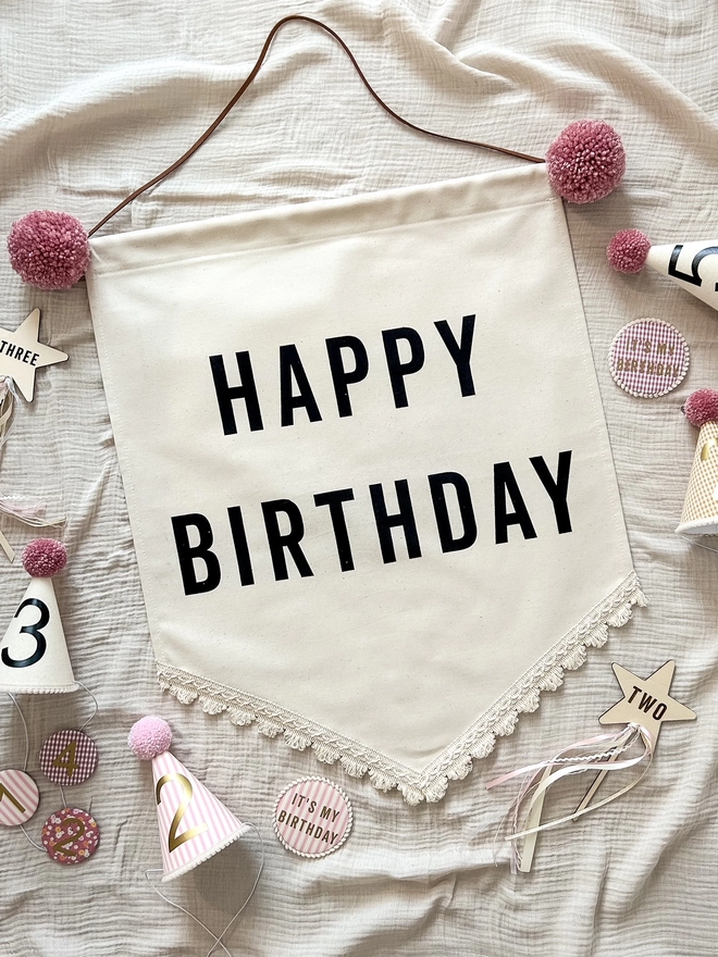 Rose Pink Pom Poms on a Canvas Happy Birthday Banner and a Boho Trim