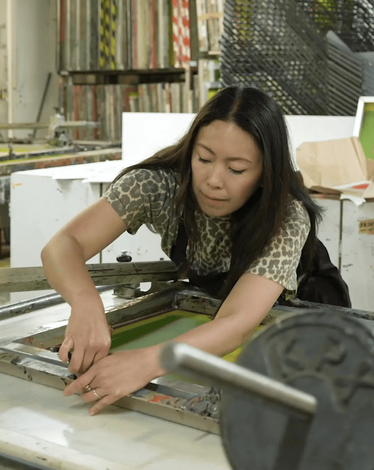 Cassandra yap in her studio printmaking