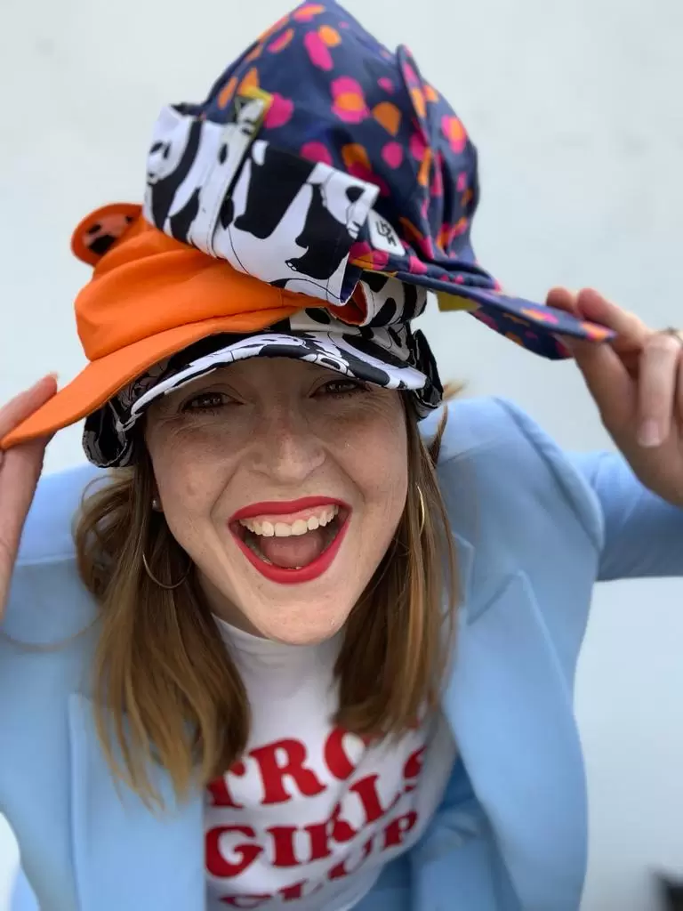 Founder Emma of Little Hotdog Watson wearing adult sun hats