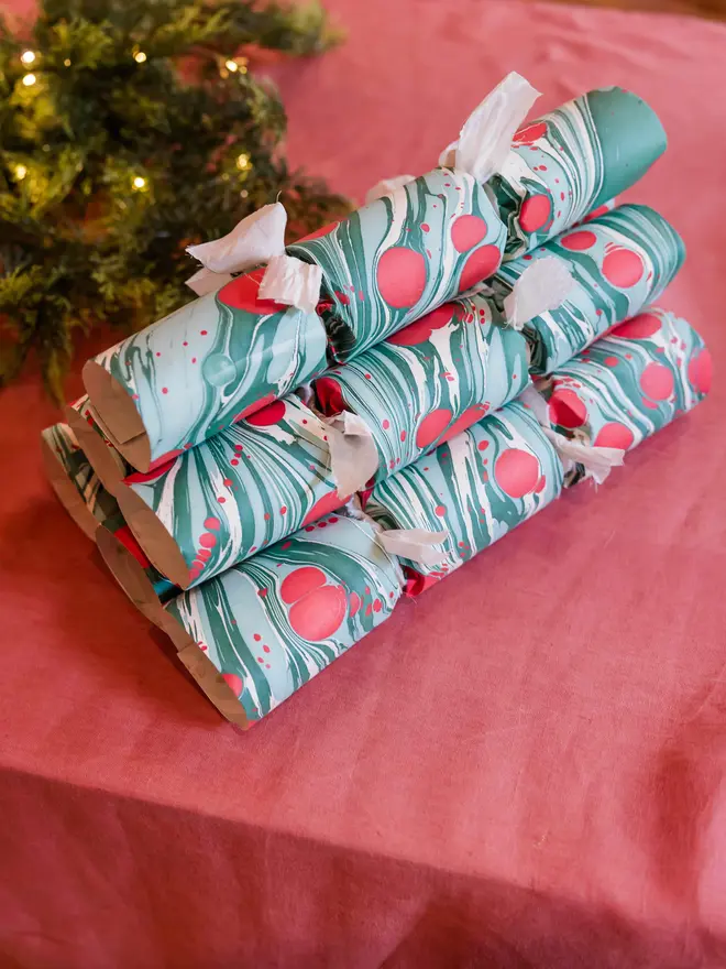 Green and red marbled Christmas crackers