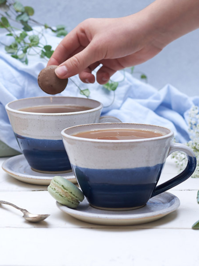 blue and white ceramic mug and saucer