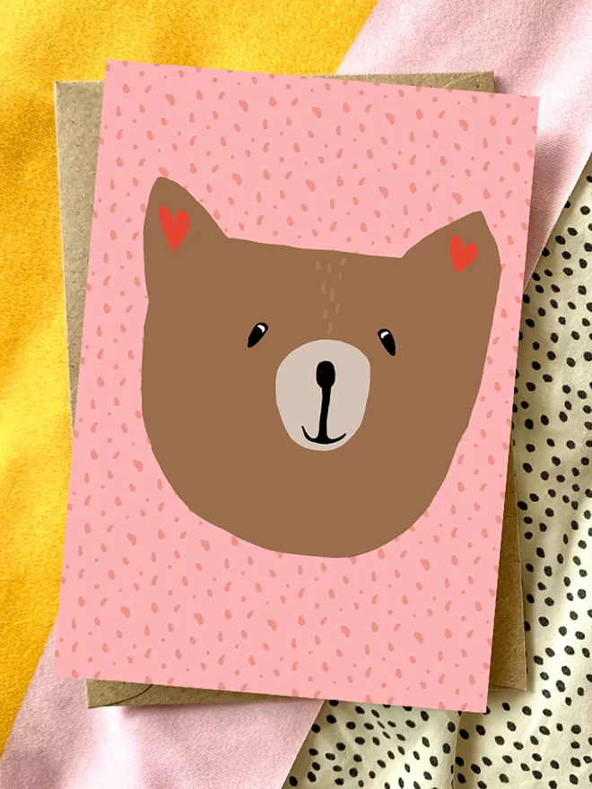 Bear's face on a pink card
