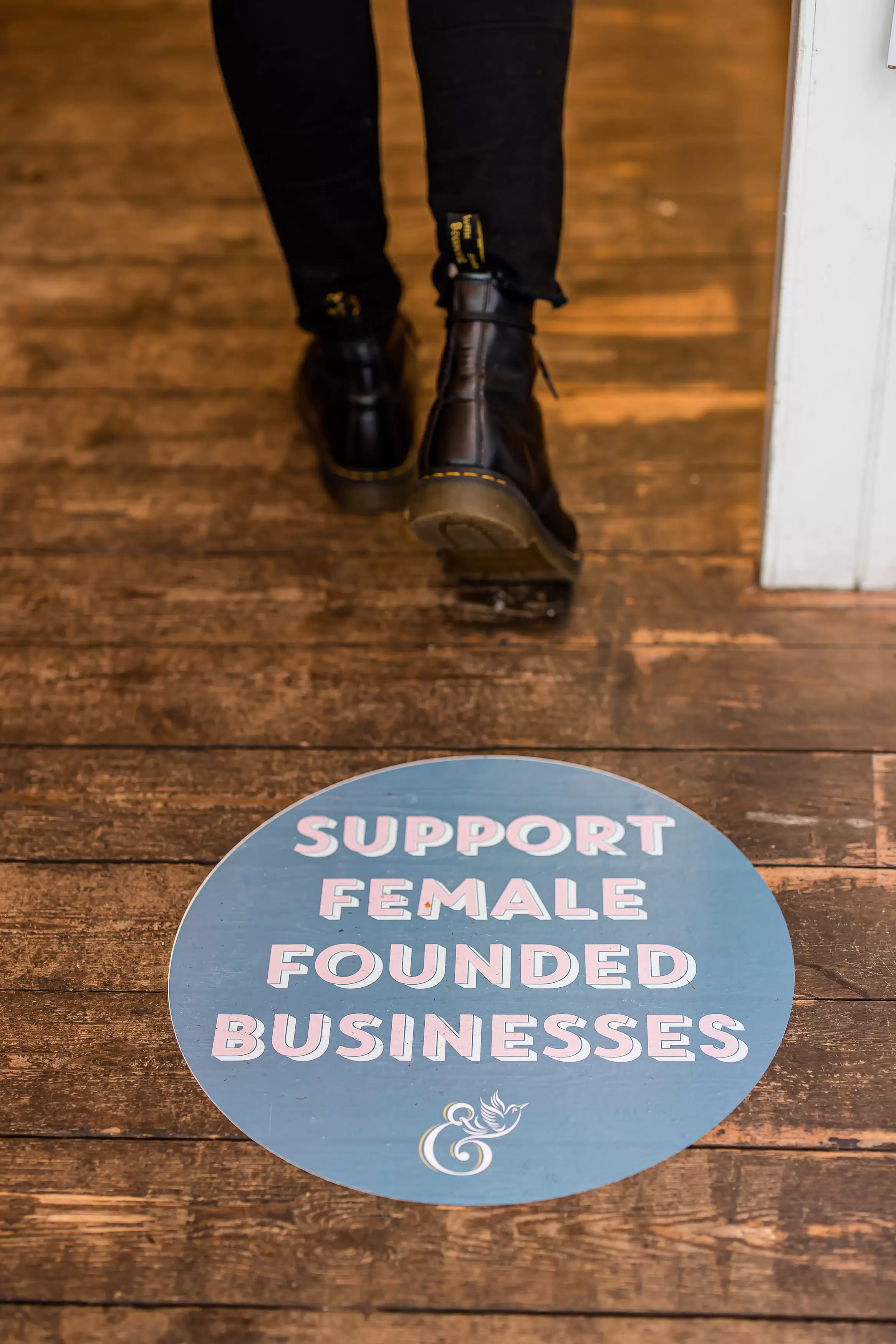 Support female founded businesses floor sticker and black Doc Martins in the Holly & Co workshop